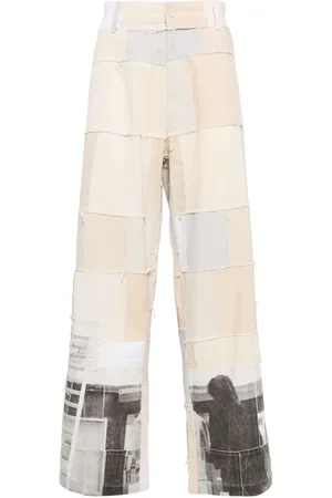 KIDSUPER STUDIOS Graphic-print panelled design trousers