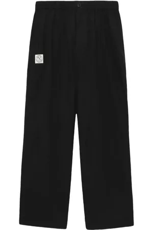 Izzue Logo-appliqué loose-fit trousers