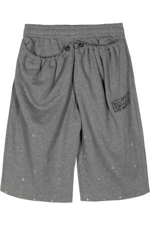 Natasha Zinko Slogan-print distressed cotton track shorts