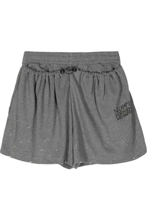 Natasha Zinko Slogan-print distressed track shorts