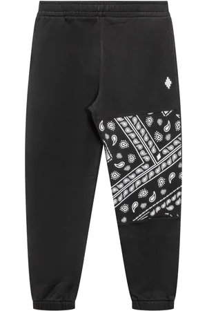 MARCELO BURLON Bandana-print track pants