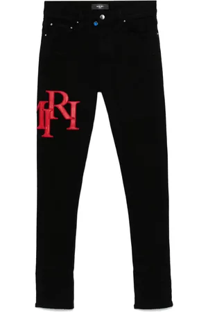 AMIRI Staggered-logo-embroidered jeans