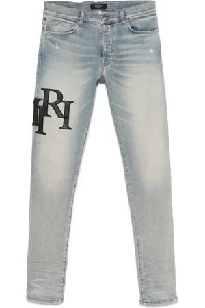 AMIRI Staggered-logo jeans