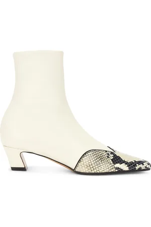Khaite Nevada Ankle Stretch 40 Boot in - Ivory. Size 36.5 (also in 37.5, 39.5, 41).