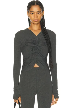 Norma Kamali Long Sleeve V Neck Shirred Front Top in - Charcoal. Size L (also in M, S, XL).