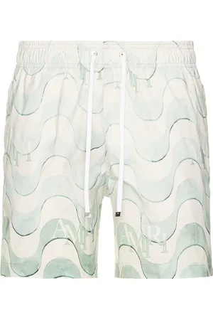 AMIRI Staggered Swim Trunk in - Teal. Size L (also in ).