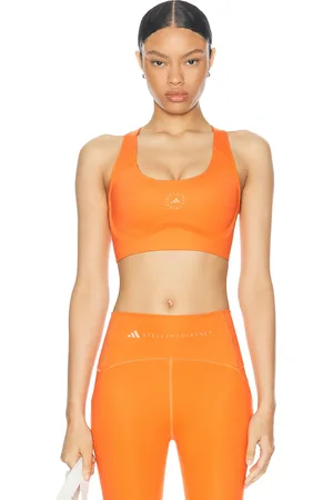 adidas Truepurpose Power Impact Training Medium Support Sports Bra in - Orange. Size XS (also in ).