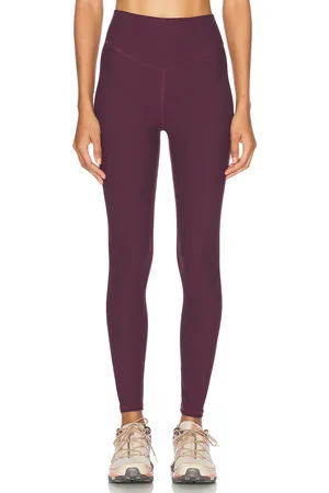 The Upside Peached 25 inch High Midi Legging in - Purple. Size L (also in M).
