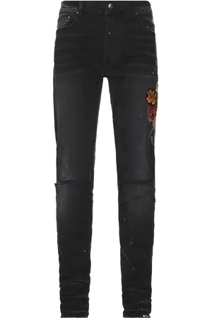 AMIRI Vintage Patch Skinny Jean in - Black. Size 29x34 (also in 30x34, 31x34, 32x34, 33x34, 34x34, 36x35, 38x35).
