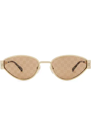 Gucci Oval Sunglasses in - Metallic Gold. Size all.