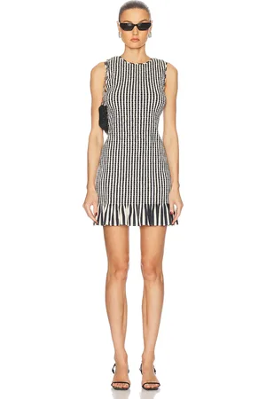 SIMON MILLER Belle Smocked Mini Dress in - Black. Size L (also in M, S, XS).
