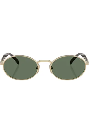 Prada Oval Sunglasses in - Metallic Gold. Size all.