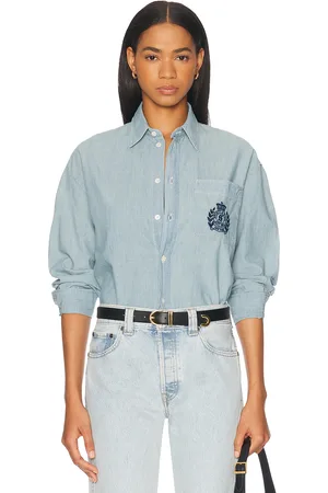 Sporty & Rich Health & Wellness Crest Oversized Button Down Top in - Denim-Medium. Size M (also in S, XL, XS).