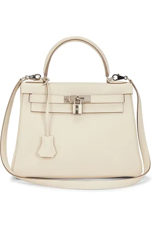 Hermès Togo Kelly 28 Retourne Handbag in - Cream. Size all.
