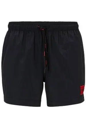 HUGO BOSS Fully lined swim shorts with red logo label