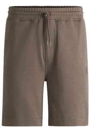 HUGO BOSS Relaxed-fit shorts in cotton terry with logo badge - Ramadan Edit