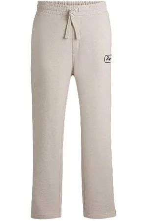 HUGO BOSS Cotton-terry tracksuit bottoms with embroidered graphics