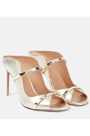 Devon laminated leather mules in gold - The Attico