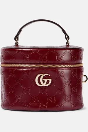 Gucci GG embossed leather vanity bag
