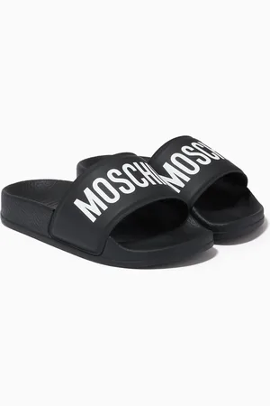Moschino logo-embossed short-pile loafers - Black