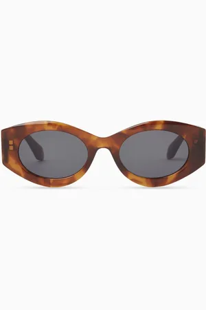 Alaïa Oval Sunglasses in Acetate
