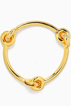 Kate Spade Interlock Bangle in -tone Brass