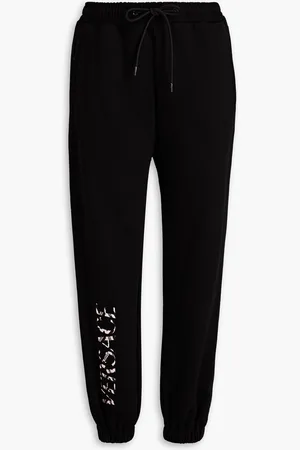 VERSACE Appliquéd French cotton-terry track pants