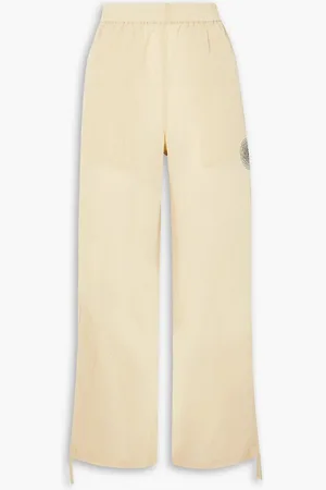 Ganni Appliquéd printed crinkled shell track pants - Neutral